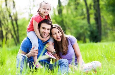 ndfamily-smiling-in-grass