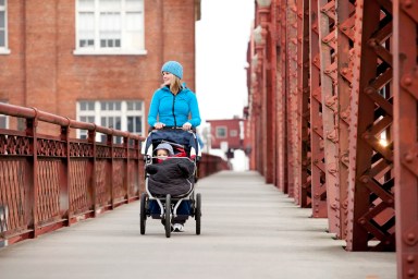 Mother exercising with her young child.