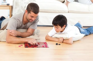 older-man-and-young-boy-playing-checkers