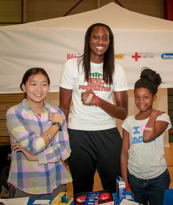 tina charles at sports safety clinic for kids in harlem