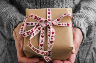 woman-holding-heart-gift