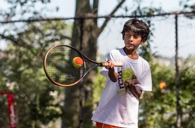 young-boy-playing-tennis