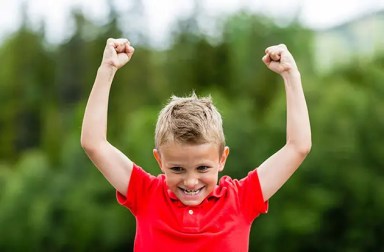 young-boy-raises-arms-failure-and-grit